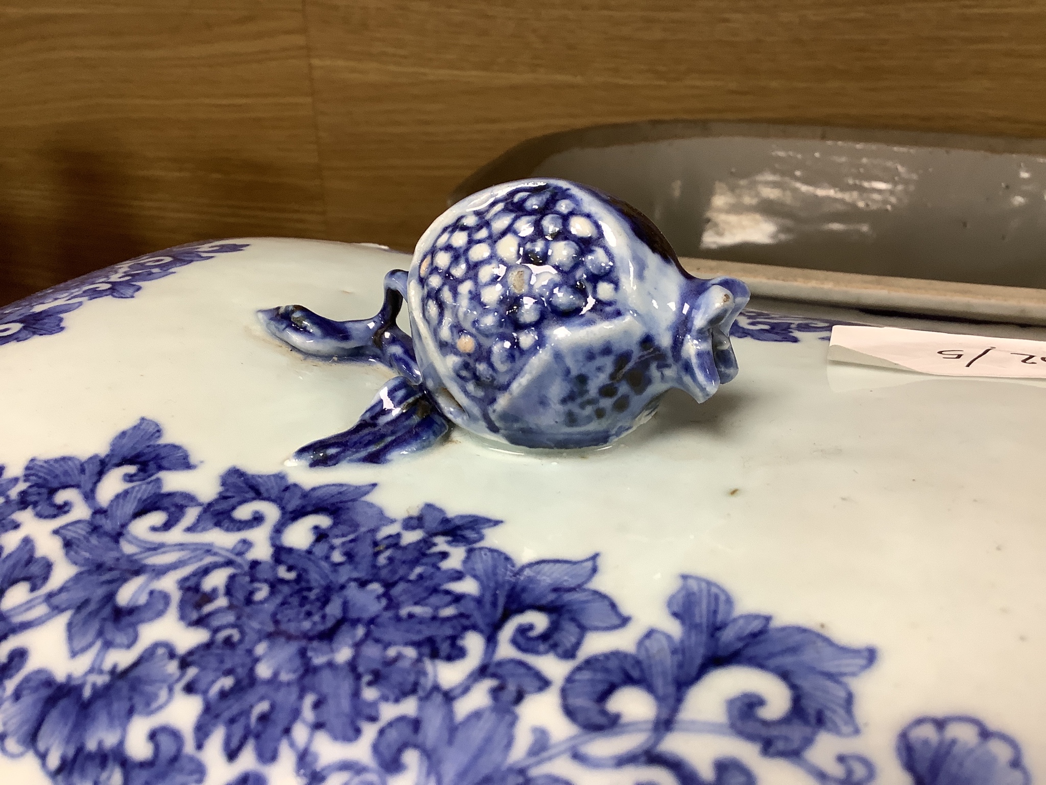 Two 18th century Chinese export blue and white lidded tureens, one lacking cover, 34cm
